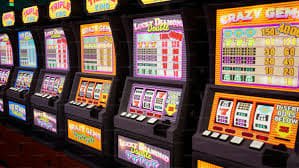 Gem Saviour slot game interface showing jewel-themed reels and payout grid