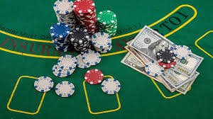 Live Sic Bo dealer studio setup showing sealed cup and dice on felt table